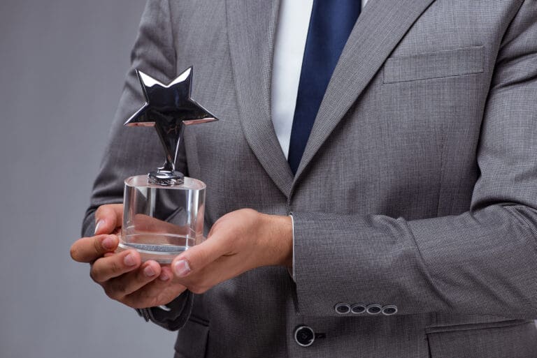 Businessman Holds Award