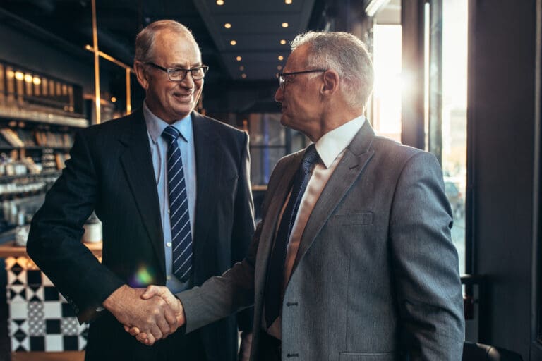 Long Time Business Partners Share a Handshake